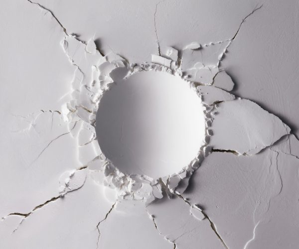 White powder texture with round impact crater. Minimalism flat lay.